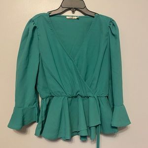 Sea green wrap around top from Francesca’s